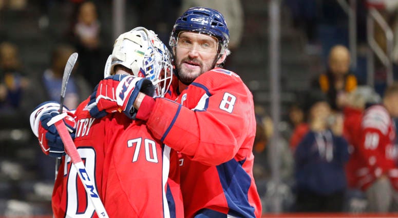 Alex Ovechkin embraces Braden Holtby. alex_ovechkin_braden_holtby