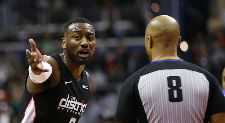 Washington Wizards guard John Wall argues with a referee. John_Wall_Wizards