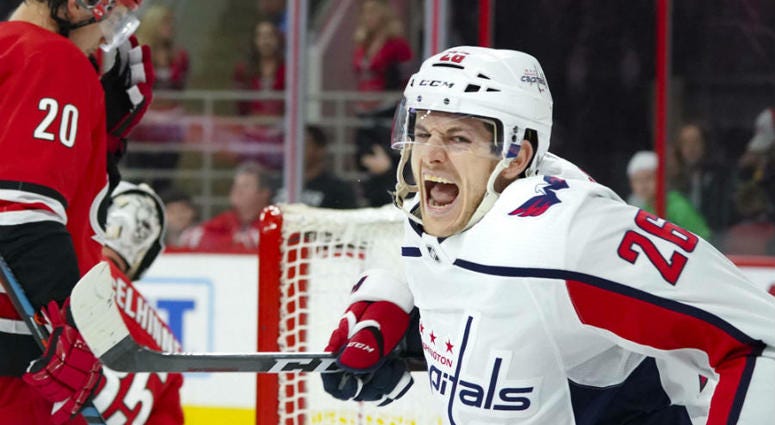 Caps forward Nic Dowd celebrates scoring the game-winning goal. Washington Capitals clinched a Stanley Cup playoff berth.