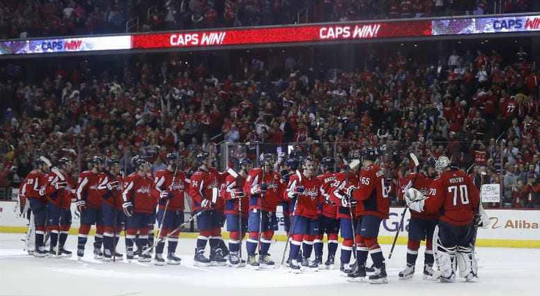 The Caps celebrate their fourth consecutive division title. Washington Capitals celebrate their fourth consecutive division title.
