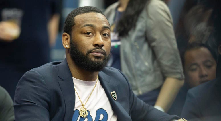 Wizards point guard John Wall. Wizards guard John Wall is seen without brace, but walking with slight limp months after surgery.