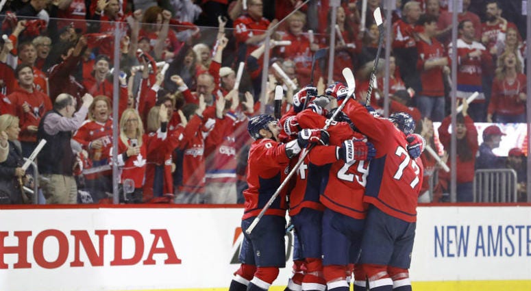 Capitals celebrate Brooks Orpik's game-winning goal. Capitals take a 2-0 series lead over the Hurricanes.