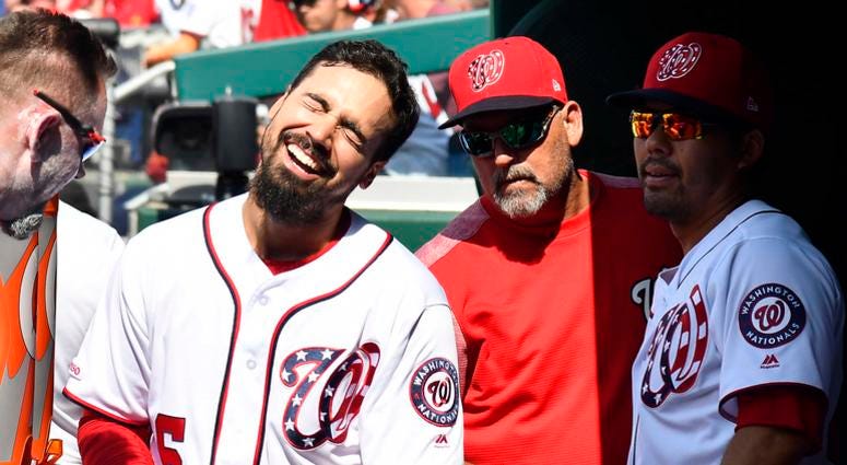 Nationals third baseman Anthony Rendon laughs in the dugout. Anthony_Rendon
