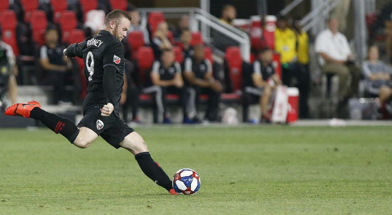 D.C. United's Wayne Rooney scores an absurd goal from his own half. D.C. United's Wayne Rooney scores an absurd goal from his own half.