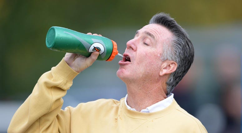 Bruce Allen casually takes a sip of water at a Redskins practice. Redskins team president Bruce Allen has had trouble pronouncing names.