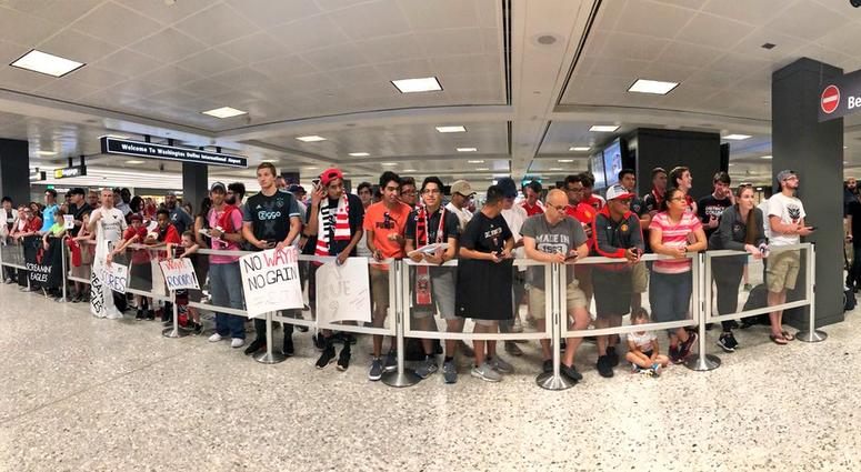 DC United fans await Wayne Rooney's arrival at Dulles Airport Wayne_Rooney_Dulles_Airport