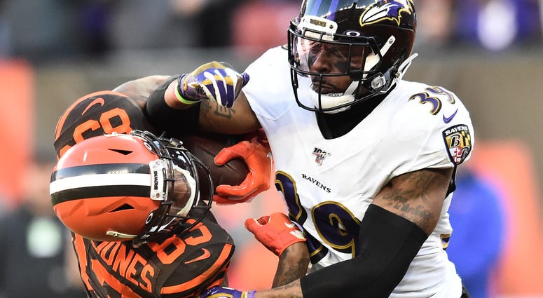 Ravens CB Brandon Carr makes a tackle in Cleveland.