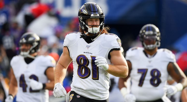 Hayden Hurst takes the field with his Ravens teammates