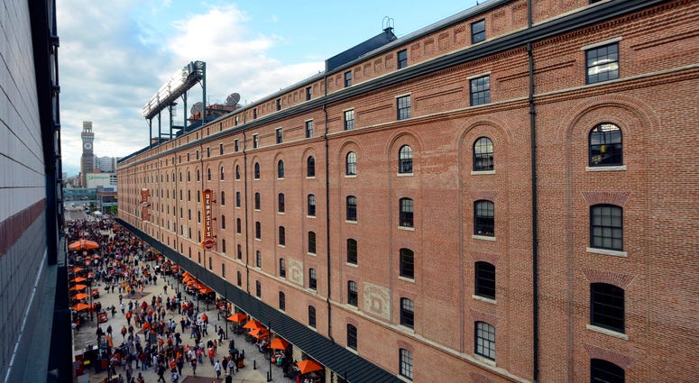 Fans walk down Eutaw Street at Oriole Park