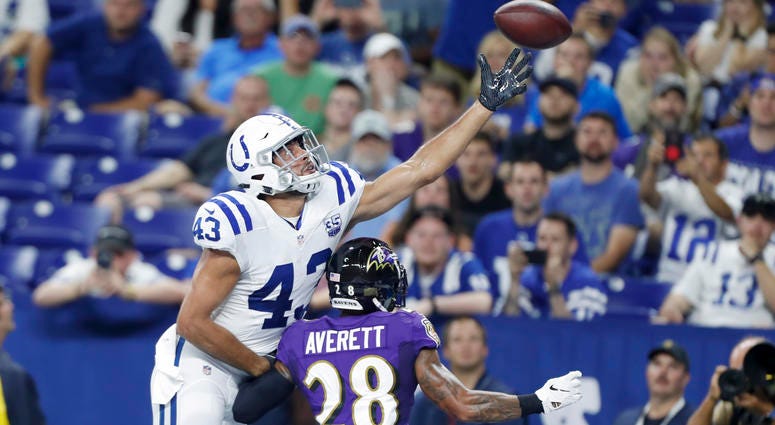 NFL: Baltimore Ravens at Indianapolis Colts Aug 20, 2018; Indianapolis, IN, USA; Indianapolis Colts tight end Ross Travis (43) tries to make a catch against Baltimore Ravens cornerback Anthony Averett (28) during the third quarter at Lucas Oil Stadium. Mandatory Credit: Brian Spurlock-USA TODAY Spo
