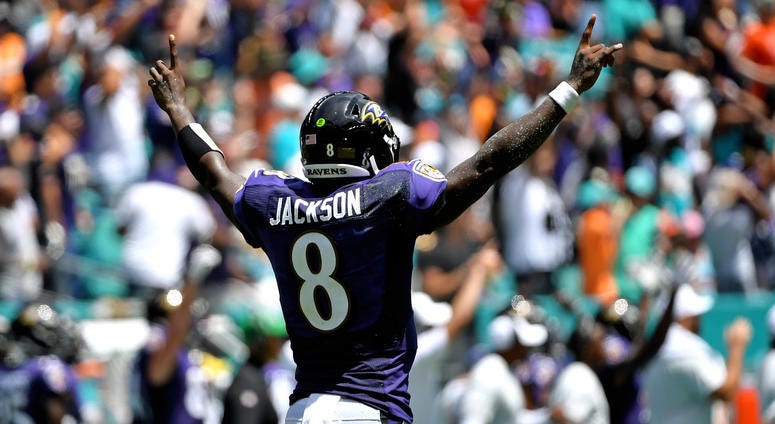 Lamar Jackson celebrates a touchdown pass