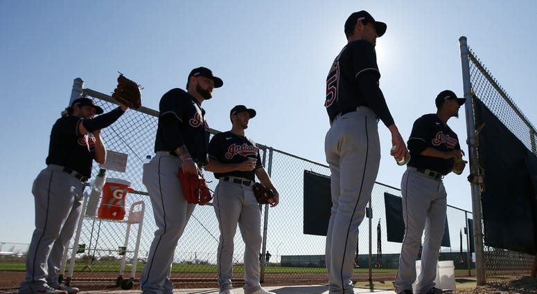 From left to right, Cleveland Indians pitchers Dominic Leone, Logan Allen, Kyle Dowdy, Shane Bieber, and Carlos Carrasco wait their turn for their pitching session during spring training baseball workouts for pitchers and catchers Thursday, Feb. 13, 2020, From left to right, Cleveland Indians pitchers Dominic Leone, Logan Allen, Kyle Dowdy, Shane Bieber, and Carlos Carrasco wait their turn for their pitching session during spring training baseball workouts for pitchers and catchers Thursday, Feb. 13, 2020,