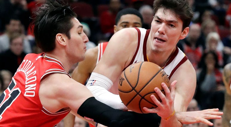 Cleveland Cavaliers forward Cedi Osman, right, drives against Chicago Bulls guard Ryan Arcidiacono during the second half of an NBA basketball game Sunday, Jan. 27, 2019, in Chicago.