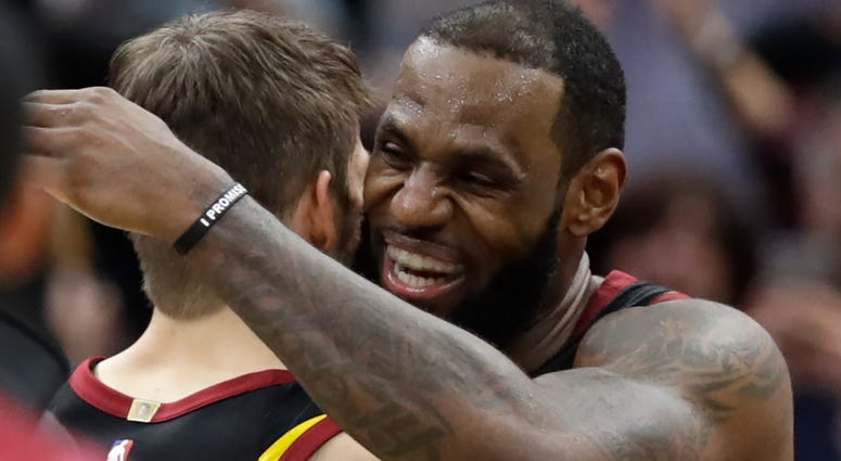 Cleveland Cavaliers' LeBron James, right, hugs Kyle Korver after hitting the game-winning shot to defeat the Toronto Raptors 105-103 in Game 3 of an NBA basketball second-round playoff series, Saturday, May 5, 2018, in Cleveland. Cleveland Cavaliers' LeBron James, right, hugs Kyle Korver after hitting the game-winning shot to defeat the Toronto Raptors 105-103 in Game 3 of an NBA basketball second-round playoff series, Saturday, May 5, 2018, in Cleveland.