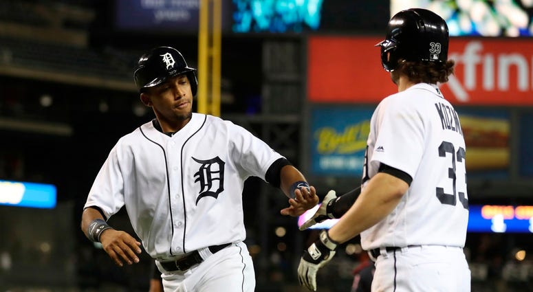 Detroit Tigers' Dixon Machado is congratulated by Pete Kozma after scoring during the seventh inning of a baseball game against the Cleveland Indians, Tuesday, May 15, 2018, in Detroit. Detroit Tigers' Dixon Machado is congratulated by Pete Kozma after scoring during the seventh inning of a baseball game against the Cleveland Indians, Tuesday, May 15, 2018, in Detroit.