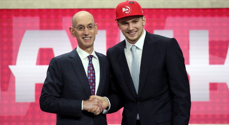 Luka Doncic, who plays for Real Madrid, poses for a picture with NBA Commissioner Adam Silver after Doncic was picked third overall by the Atlanta Hawks during the NBA basketball draft in New York, Thursday, June 21, 2018. Luka Doncic, who plays for Real Madrid, poses for a picture with NBA Commissioner Adam Silver after Doncic was picked third overall by the Atlanta Hawks during the NBA basketball draft in New York, Thursday, June 21, 2018.