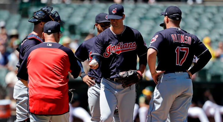 Cleveland Indians starting pitcher Adam Plutko, center, is pulled from the game by manager Terry Francona, left, during the sixth inning of a baseball game against the Oakland Athletics ,Saturday, June 30, 2018, in Oakland, Calif. Cleveland Indians starting pitcher Adam Plutko, center, is pulled from the game by manager Terry Francona, left, during the sixth inning of a baseball game against the Oakland Athletics ,Saturday, June 30, 2018, in Oakland, Calif.