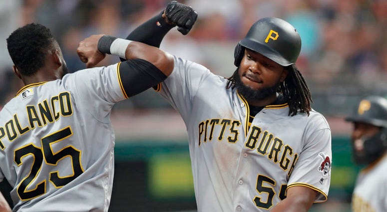 Pittsburgh Pirates' Josh Bell, right, is congratulated by Gregory Polanco after Bell hit a two-run home run in the fifth inning of a baseball game, Tuesday, July 24, 2018, in Cleveland. Pittsburgh Pirates' Josh Bell, right, is congratulated by Gregory Polanco after Bell hit a two-run home run in the fifth inning of a baseball game, Tuesday, July 24, 2018, in Cleveland.
