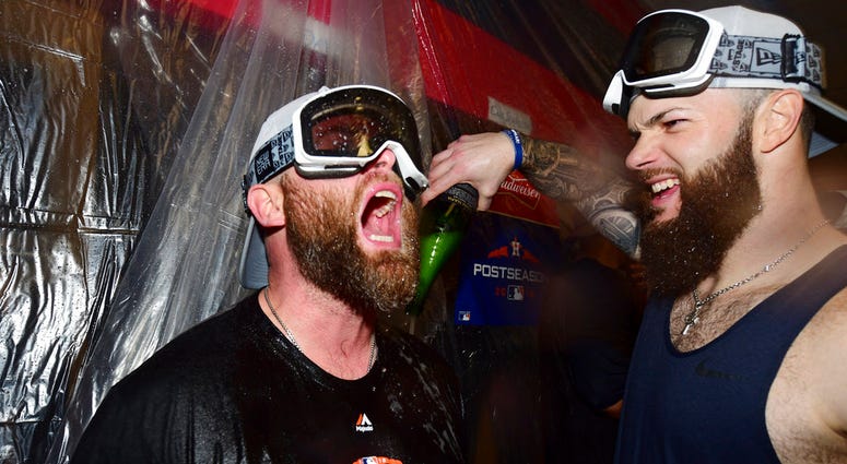 Houston Astros starting pitcher Dallas Keuchel, right, celebrates with Brian McCann after the Astros defeated the Cleveland Indians 11-3 in Game 3 of a baseball American League Division Series, Monday, Oct. 8, 2018, in Cleveland. (AP Photo/David Dermer) Houston Astros starting pitcher Dallas Keuchel, right, celebrates with Brian McCann after the Astros defeated the Cleveland Indians 11-3 in Game 3 of a baseball American League Division Series, Monday, Oct. 8, 2018, in Cleveland.