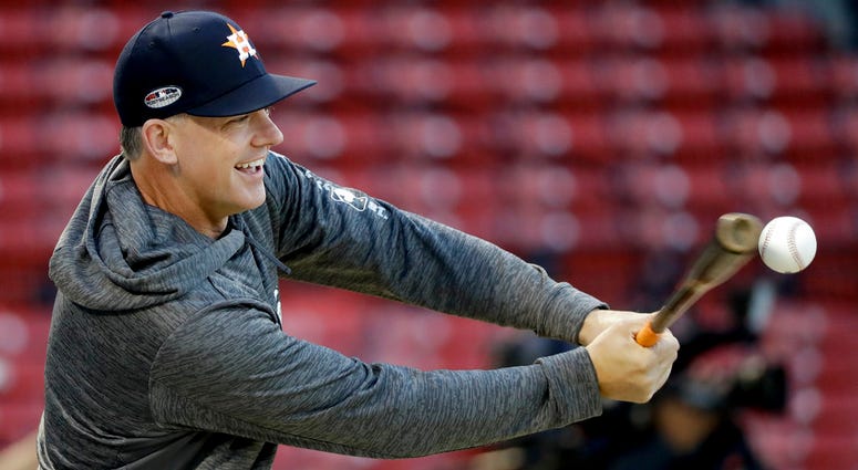 Houston Astros manager AJ Hinch hits during batting practice before Game 2 of a baseball American League Championship Series against the Boston Red Sox on Sunday, Oct. 14, 2018, in Boston. Houston Astros manager AJ Hinch hits during batting practice before Game 2 of a baseball American League Championship Series against the Boston Red Sox on Sunday, Oct. 14, 2018, in Boston.