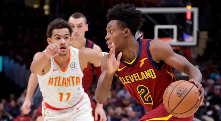 Cleveland Cavaliers' Collin Sexton (2) drives past Atlanta Hawks' Trae Young (11) in the first half of an NBA basketball game, Sunday, Oct. 21, 2018, in Cleveland. Cleveland Cavaliers' Collin Sexton (2) drives past Atlanta Hawks' Trae Young (11) in the first half of an NBA basketball game, Sunday, Oct. 21, 2018, in Cleveland.