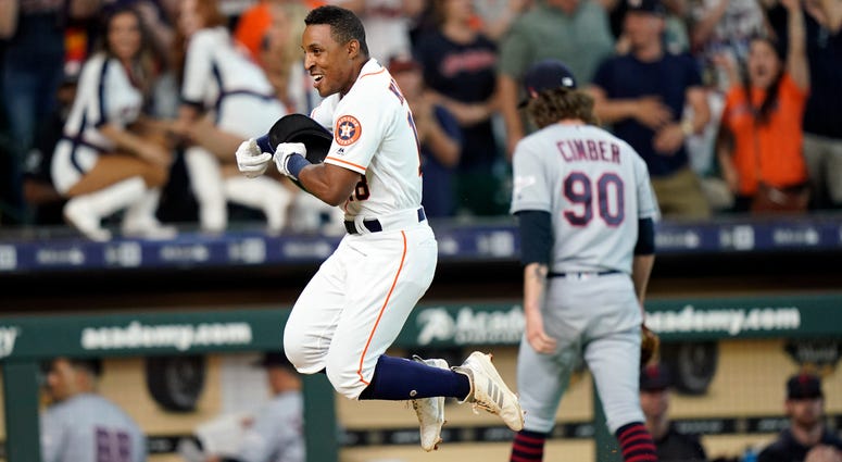 Houston Astros' Tony Kemp, left, celebrates after hitting the game-winning home run as Cleveland Indians relief pitcher Adam Cimber (90) walks to the dugout during the 10th inning of a baseball game Saturday, April 27, 2019, in Houston. The Astros won 4-3 Houston Astros' Tony Kemp, left, celebrates after hitting the game-winning home run as Cleveland Indians relief pitcher Adam Cimber (90) walks to the dugout during the 10th inning of a baseball game Saturday, April 27, 2019, in Houston. The Astros won 4-3