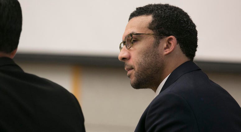 Former NFL football player Kellen Winslow Jr. looks at attorney Marc Carlos during his rape trial, Monday, May 20, 2019, in Vista, Calif.