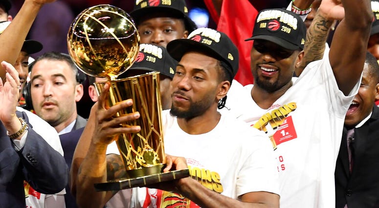 Toronto Raptors forward Kawhi Leonard holds Larry O'Brien NBA Championship Trophy after the Raptors defeated the Golden State Warriors 114-110 in Game 6 of basketball’s NBA Finals, Thursday, June 13, 2019, in Oakland, Calif. (Frank Gunn/The Canadian Press Toronto Raptors forward Kawhi Leonard holds Larry O'Brien NBA Championship Trophy after the Raptors defeated the Golden State Warriors 114-110 in Game 6 of basketball’s NBA Finals, Thursday, June 13, 2019, in Oakland, Calif. (Frank Gunn/The Canadian Press