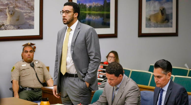 Ex-NFL player Kellen Winslow II, standing, answers a question from San Diego County Superior Court Vista Judge Blaine Bowman during a status hearing Friday, June 14, 2019 in Vista, Calif.