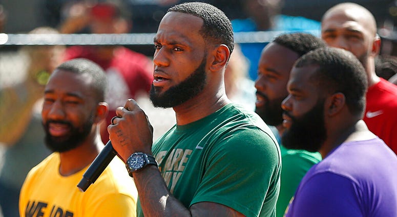 LeBron James speaks during the debut of the new basketball court at I Promise School, Wednesday, Aug. 14, 2019, in Akron, Ohio. The NBA superstar is spending more than $1 million on various upgrades for the school. (Jeff Lange/Akron Beacon Journal via AP) LeBron James speaks during the debut of the new basketball court at I Promise School, Wednesday, Aug. 14, 2019, in Akron, Ohio. The NBA superstar is spending more than $1 million on various upgrades for the school. (Jeff Lange/Akron Beacon Journal via AP)