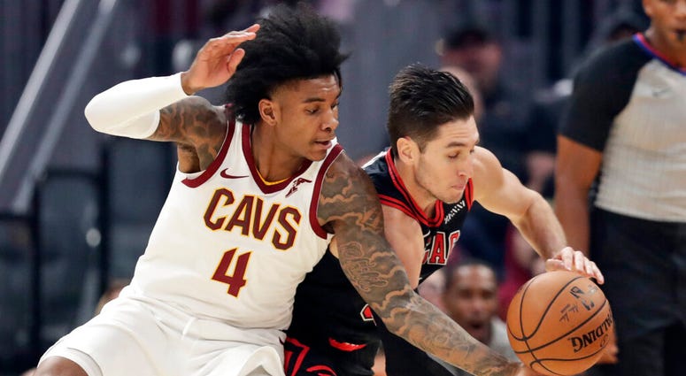 Cleveland Cavaliers' Kevin Porter Jr. (4) and Chicago Bulls' Ryan Arcidiacono (51) compete for the ball during the first half of an NBA basketball game Wednesday, Oct. 30, 2019, in Cleveland. (AP Photo/Tony Dejak) Cleveland Cavaliers' Kevin Porter Jr. (4) and Chicago Bulls' Ryan Arcidiacono (51) compete for the ball during the first half of an NBA basketball game Wednesday, Oct. 30, 2019, in Cleveland. (AP Photo/Tony Dejak)