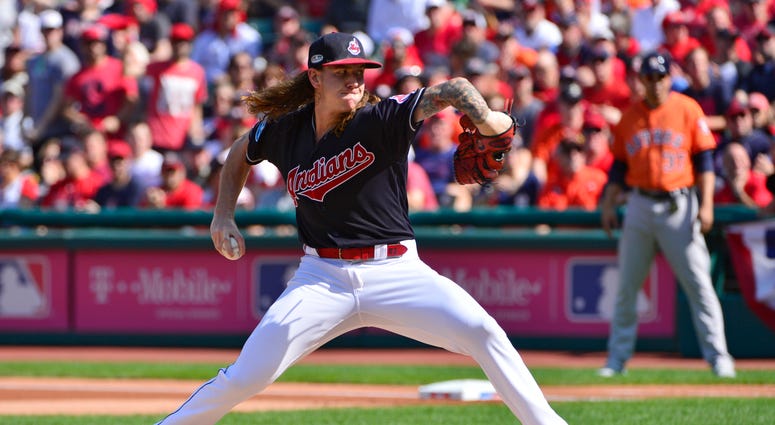 In this Oct. 8, 2018, file photo, Cleveland Indians starting pitcher Mike Clevinger delivers in the first inning during Game 3 of a baseball American League Division Series against the Houston Astros in Cleveland. In this Oct. 8, 2018, file photo, Cleveland Indians starting pitcher Mike Clevinger delivers in the first inning during Game 3 of a baseball American League Division Series against the Houston Astros in Cleveland.