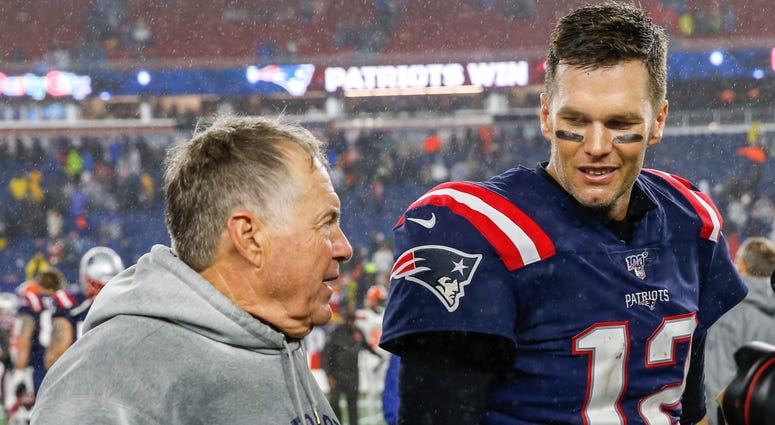 Oct 27, 2019; Foxborough, MA, USA; New England Patriots head coach Bill Belichick with quarterback Tom Brady (12) after defeating the Cleveland Browns at Gillette Stadium. New England Patriots head coach Bill Belichick (left) and former quarterback Tom Brady (right)