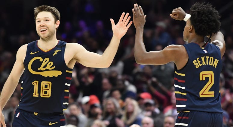 Mar 7, 2020; Cleveland, Ohio, USA; Cleveland Cavaliers guard Matthew Dellavedova (18) celebrates with guard Collin Sexton (2) during the second half against the Denver Nuggets at Rocket Mortgage FieldHouse. Cavaliers guard Matthew Dellavadova and Collin Sexton