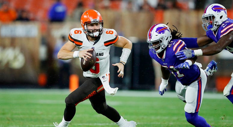 CLEVELAND, OH - AUGUST 17: Baker Mayfield #6 of the Cleveland Browns looks to pass while pursued by Julian Stanford #51 of the Buffalo Bills in the third quarter of a preseason game at FirstEnergy Stadium on August 17, 2018 in Cleveland, Ohio. (Photo by J CLEVELAND, OH - AUGUST 17: Baker Mayfield #6 of the Cleveland Browns looks to pass while pursued by Julian Stanford #51 of the Buffalo Bills in the third quarter of a preseason game at FirstEnergy Stadium on August 17, 2018 in Cleveland, Ohio. (Photo by J