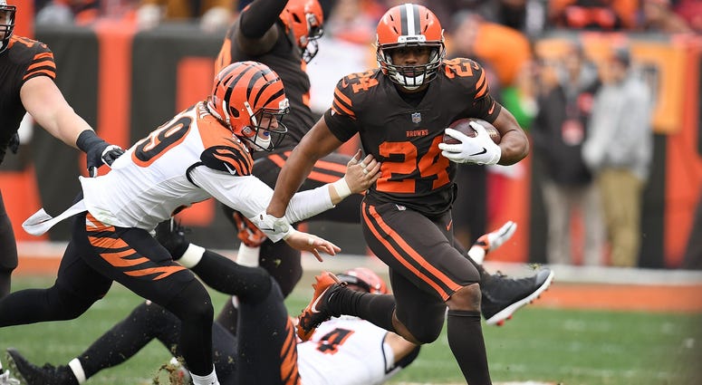 CLEVELAND, OH - DECEMBER 23: Nick Chubb #24 of the Cleveland Browns carries the ball in front of Nick Vigil #59 of the Cincinnati Bengals during the first half at FirstEnergy Stadium on December 23, 2018 in Cleveland, Ohio. (Photo by Jason Miller/Getty Im CLEVELAND, OH - DECEMBER 23: Nick Chubb #24 of the Cleveland Browns carries the ball in front of Nick Vigil #59 of the Cincinnati Bengals during the first half at FirstEnergy Stadium on December 23, 2018 in Cleveland, Ohio. (Photo by Jason Miller/Getty Im