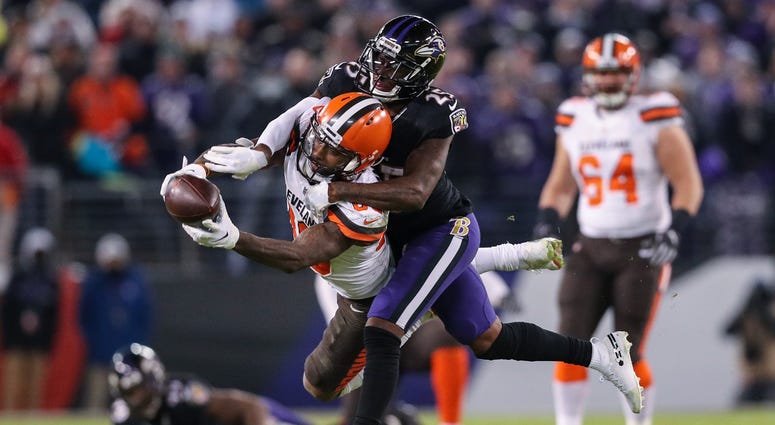BALTIMORE, MARYLAND - DECEMBER 30: Wide Receiver Jarvis Landry #80 of the Cleveland Browns is tackled after a reception by cornerback Tavon Young #25 of the Baltimore Ravens in the fourth quarter at M&T Bank Stadium on December 30, 2018 in Baltimore, Mary BALTIMORE, MARYLAND - DECEMBER 30: Wide Receiver Jarvis Landry #80 of the Cleveland Browns is tackled after a reception by cornerback Tavon Young #25 of the Baltimore Ravens in the fourth quarter at M&T Bank Stadium on December 30, 2018 in Baltimore, Mary