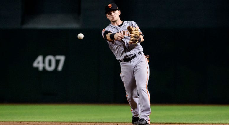 PHOENIX, ARIZONA - AUGUST 15: Scooter Gennett #14 of the San Francisco Giants makes the out at first in the ninth inning of the MLB game against the Arizona Diamondbacks at Chase Field on August 15, 2019 in Phoenix, Arizona. The San Francisco Giants won 7 PHOENIX, ARIZONA - AUGUST 15: Scooter Gennett #14 of the San Francisco Giants makes the out at first in the ninth inning of the MLB game against the Arizona Diamondbacks at Chase Field on August 15, 2019 in Phoenix, Arizona. The San Francisco Giants won 7