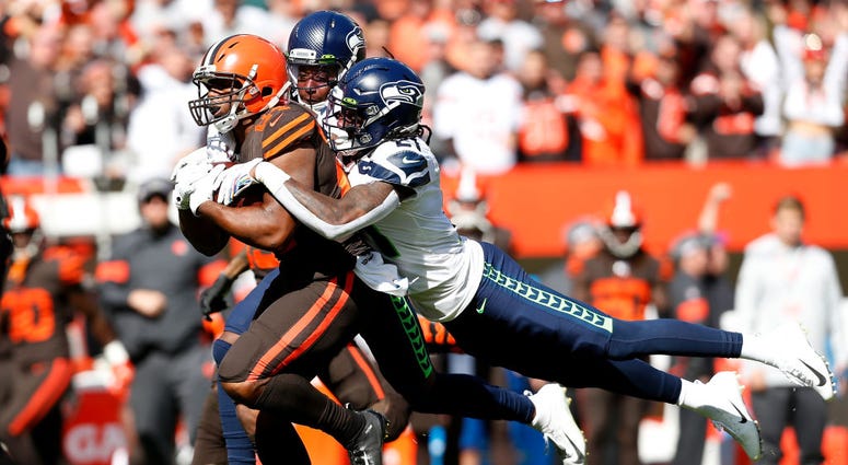 CLEVELAND, OH - OCTOBER 13: Shaquill Griffin #26 of the Seattle Seahawks and Tre Flowers #21 combine to tackle Nick Chubb #24 of the Cleveland Browns during the first quarter at FirstEnergy Stadium on October 13, 2019 in Cleveland, Ohio. (Photo by Kirk Ir CLEVELAND, OH - OCTOBER 13: Shaquill Griffin #26 of the Seattle Seahawks and Tre Flowers #21 combine to tackle Nick Chubb #24 of the Cleveland Browns during the first quarter at FirstEnergy Stadium on October 13, 2019 in Cleveland, Ohio. (Photo by Kirk Ir