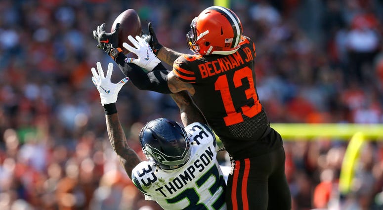 CLEVELAND, OH - OCTOBER 13: Odell Beckham Jr. #13 of the Cleveland Browns catches a pass over the defense of Tedric Thompson #33 of the Seattle Seahawks during the second quarter at FirstEnergy Stadium on October 13, 2019 in Cleveland, Ohio. (Photo by Kir CLEVELAND, OH - OCTOBER 13: Odell Beckham Jr. #13 of the Cleveland Browns catches a pass over the defense of Tedric Thompson #33 of the Seattle Seahawks during the second quarter at FirstEnergy Stadium on October 13, 2019 in Cleveland, Ohio. (Photo by Kir