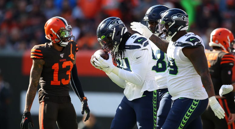 CLEVELAND, OHIO - OCTOBER 13: Ezekiel Ansah #94 of the Seattle Seahawks celebrates his third quarter fumble recovery with teammates in front of Odell Beckham #13 of the Cleveland Browns at FirstEnergy Stadium on October 13, 2019 in Cleveland, Ohio. (Photo CLEVELAND, OHIO - OCTOBER 13: Ezekiel Ansah #94 of the Seattle Seahawks celebrates his third quarter fumble recovery with teammates in front of Odell Beckham #13 of the Cleveland Browns at FirstEnergy Stadium on October 13, 2019 in Cleveland, Ohio. (Photo