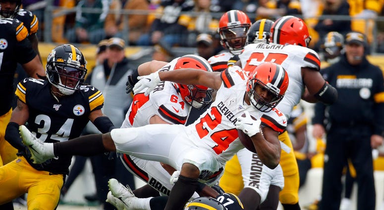 PITTSBURGH, PA - DECEMBER 01: Nick Chubb #24 of the Cleveland Browns rushes against Mike Hilton #28 and Terrell Edmunds #34 of the Pittsburgh Steelers in the first half on December 1, 2019 at Heinz Field in Pittsburgh, Pennsylvania. (Photo by Justin K. Al PITTSBURGH, PA - DECEMBER 01: Nick Chubb #24 of the Cleveland Browns rushes against Mike Hilton #28 and Terrell Edmunds #34 of the Pittsburgh Steelers in the first half on December 1, 2019 at Heinz Field in Pittsburgh, Pennsylvania. (Photo by Justin K. Al