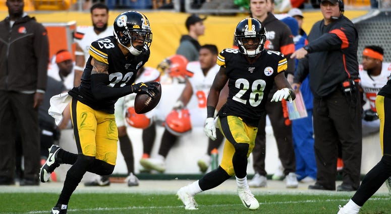 Joe Haden #23 of the Pittsburgh Steelers runs up field after intercepting a pass by Baker Mayfield #6 of the Cleveland Browns in the fourth quarter during the game at Heinz Field on December 1, 2019 in Pittsburgh, Pennsylvania. Joe Haden Baker Mayfield interception Cleveland Browns Pittsburgh Steelers