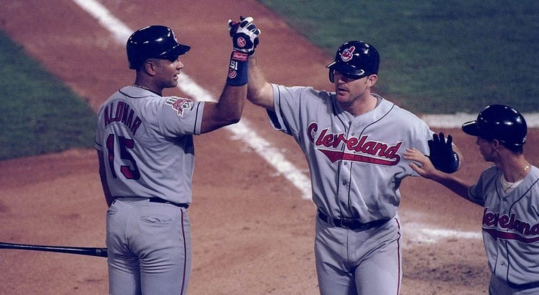 18 Oct 1997: First baseman Jim Thome and catcher Sandy Alomar of the Cleveland Indians high five each other during game one of the World Series against the Florida Marlins at Pro Player Park in Miami, Florida. The Marlins won the game 7-4. 18 Oct 1997: First baseman Jim Thome and catcher Sandy Alomar of the Cleveland Indians high five each other during game one of the World Series against the Florida Marlins at Pro Player Park in Miami, Florida. The Marlins won the game 7-4.