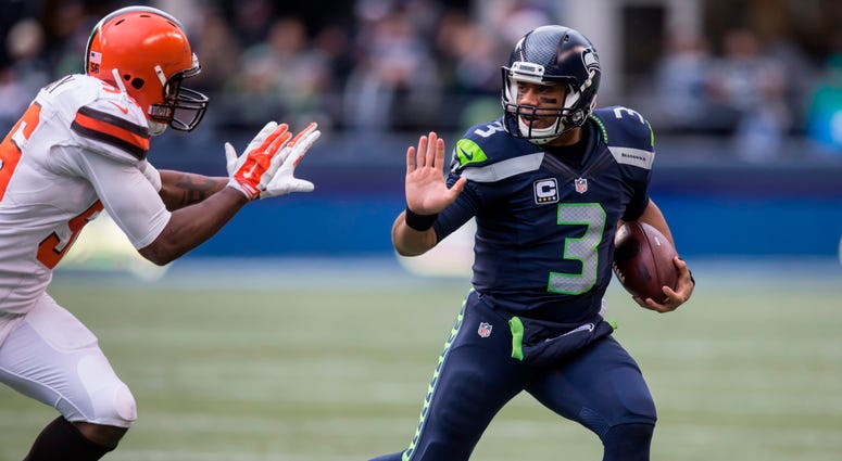 SEATTLE, WA - DECEMBER 20: Quarterback Russell Wilson #3 of the Seattle Seahawks runs with the ball during the first half of a football game against the Cleveland Browns at CenturyLink Field on December 20, 2015 in Seattle, Washington. The Seahawks won th SEATTLE, WA - DECEMBER 20: Quarterback Russell Wilson #3 of the Seattle Seahawks runs with the ball during the first half of a football game against the Cleveland Browns at CenturyLink Field on December 20, 2015 in Seattle, Washington. The Seahawks won th