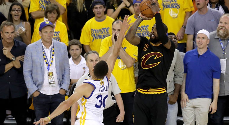 OAKLAND, CA - JUNE 19: Kyrie Irving #2 of the Cleveland Cavaliers shoots a three-point basket against the Golden State Warriors in Game 7 of the 2016 NBA Finals at ORACLE Arena on June 19, 2016 in Oakland, California. NOTE TO USER: User expressly acknowle OAKLAND, CA - JUNE 19: Kyrie Irving #2 of the Cleveland Cavaliers shoots a three-point basket against the Golden State Warriors in Game 7 of the 2016 NBA Finals at ORACLE Arena on June 19, 2016 in Oakland, California. NOTE TO USER: User expressly acknowle