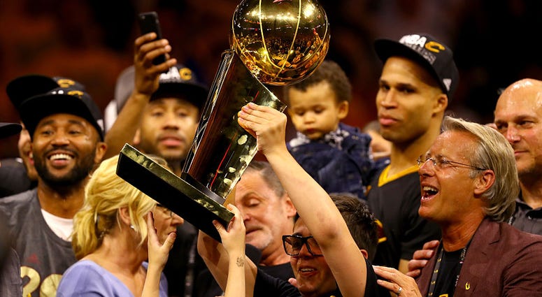 OAKLAND, CA - JUNE 19: Nick Gilbert, son of Cleveland Cavaliers owner Dan Gilbert, holds the Larry O'Brien Championship Trophy after the Cavaliers defeated the Golden State Warriors 93-89 in Game 7 of the 2016 NBA Finals at ORACLE Arena on June 19, 2016 i OAKLAND, CA - JUNE 19: Nick Gilbert, son of Cleveland Cavaliers owner Dan Gilbert, holds the Larry O'Brien Championship Trophy after the Cavaliers defeated the Golden State Warriors 93-89 in Game 7 of the 2016 NBA Finals at ORACLE Arena on June 19, 2016 i