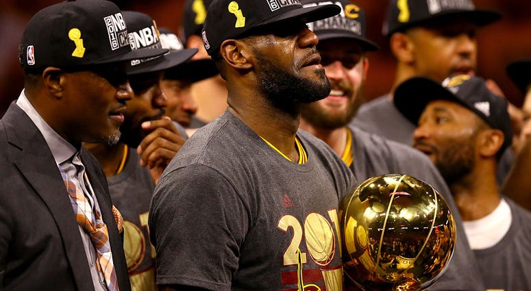 OAKLAND, CA - JUNE 19: LeBron James #23 of the Cleveland Cavaliers celebrates with the Larry O'Brien Championship Trophy after defeating the Golden State Warriors 93-89 in Game 7 of the 2016 NBA Finals at ORACLE Arena on June 19, 2016 in Oakland, Californ OAKLAND, CA - JUNE 19: LeBron James #23 of the Cleveland Cavaliers celebrates with the Larry O'Brien Championship Trophy after defeating the Golden State Warriors 93-89 in Game 7 of the 2016 NBA Finals at ORACLE Arena on June 19, 2016 in Oakland, Californ