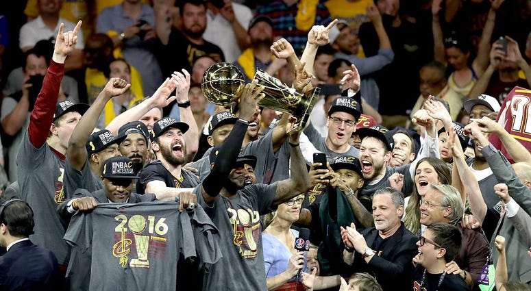 OAKLAND, CA - JUNE 19: LeBron James #23 of the Cleveland Cavaliers celebrates with the Larry O'Brien Championship Trophy after defeating the Golden State Warriors 93-89 in Game 7 of the 2016 NBA Finals at ORACLE Arena on June 19, 2016 in Oakland, Californ OAKLAND, CA - JUNE 19: LeBron James #23 of the Cleveland Cavaliers celebrates with the Larry O'Brien Championship Trophy after defeating the Golden State Warriors 93-89 in Game 7 of the 2016 NBA Finals at ORACLE Arena on June 19, 2016 in Oakland, Californ