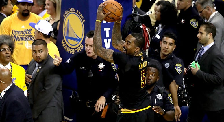 OAKLAND, CA - JUNE 19: J.R. Smith #5 of the Cleveland Cavaliers grabs the game ball at the end of Game 7 after defeating the Golden State Warriors in the 2016 NBA Finals at ORACLE Arena on June 19, 2016 in Oakland, California. NOTE TO USER: User expressly OAKLAND, CA - JUNE 19: J.R. Smith #5 of the Cleveland Cavaliers grabs the game ball at the end of Game 7 after defeating the Golden State Warriors in the 2016 NBA Finals at ORACLE Arena on June 19, 2016 in Oakland, California. NOTE TO USER: User expressly